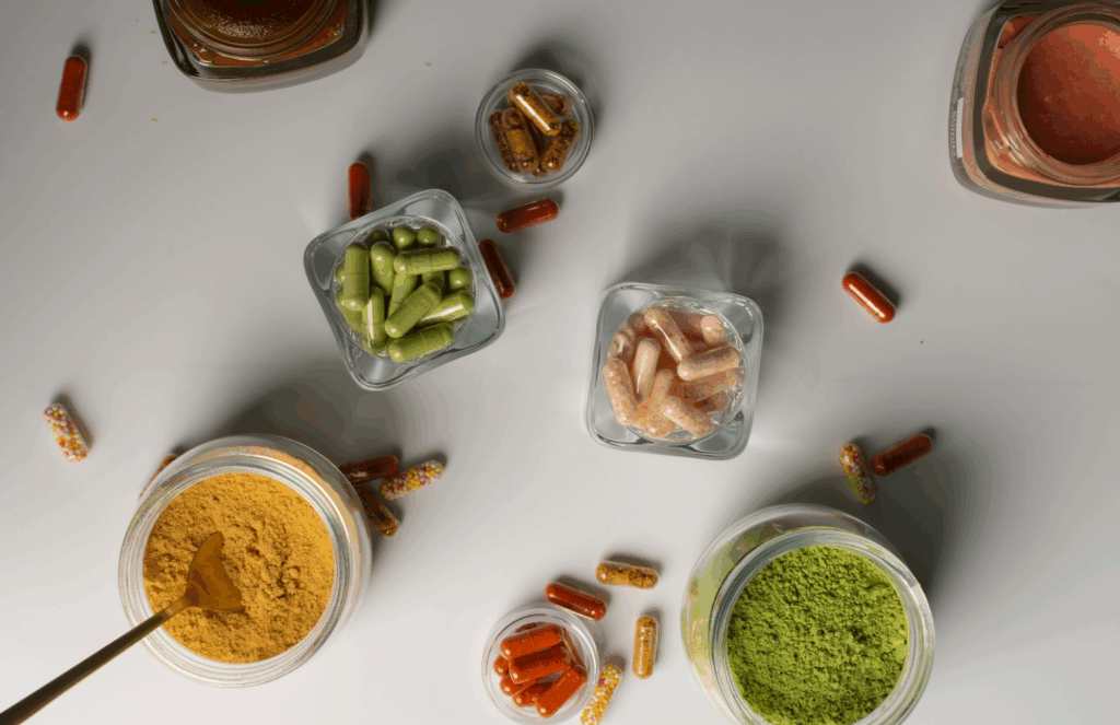 assorted dietary supplements and powders including capsules, greens, and nutrients to support immune and hormonal health