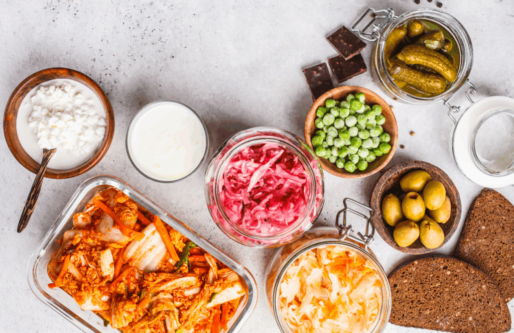 fermented foods including kimchi, sauerkraut, kefir, and pickles to support gut health and immune function