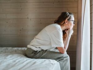 Woman relaxing in soft natural light, representing the natural ebb and flow of women’s libido.